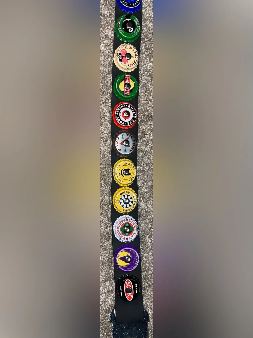 Little Earth seatbelt belt bottle caps
